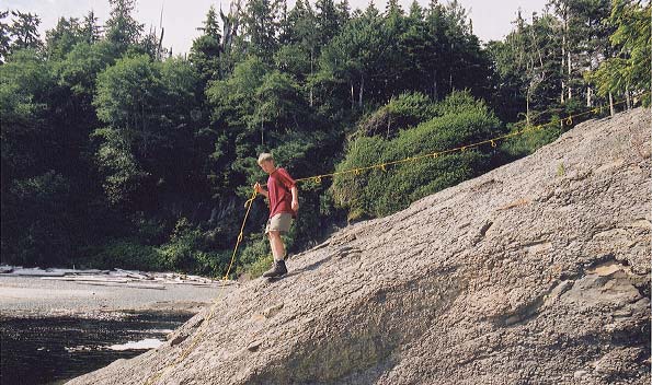 Dylan climbs down Calvin Falls, using a handy rope.