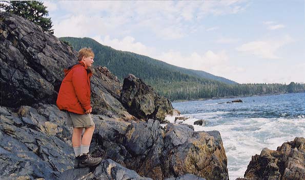 Dylan climbing on the rocks by Third Beach.